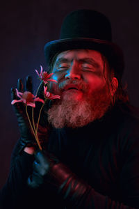 Portrait of senior man smoking cigarette