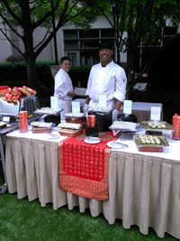 Portrait of a man standing by table