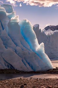 Scenic view of glacier landscape against sky during fall