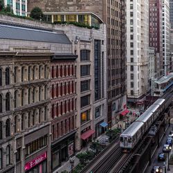 High angle view of railroad tracks amidst buildings in city