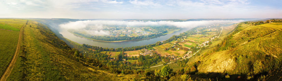 Beautiful panorama dniester river canyon. ukraine, europe. morning fog over village valley park