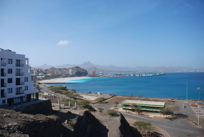 Panoramic view of sea and buildings against sky