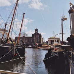 Boats moored at harbor