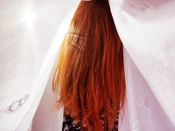 High angle portrait of woman standing in bathroom