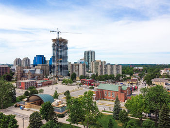 High angle view of buildings in city against sky