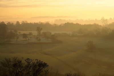 Scenic view of landscape against sky during sunset