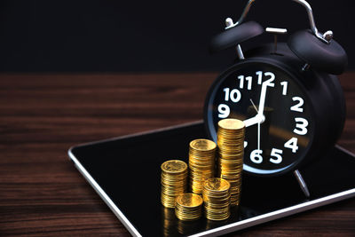 Close-up of clock on table
