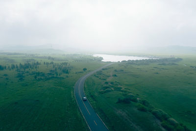 High angle view of road amidst landscape against sky