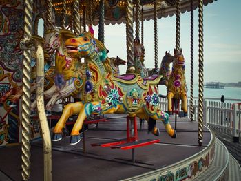 Panoramic shot of amusement park ride against sky