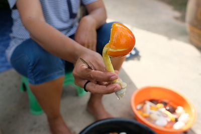 Midsection of man preparing food