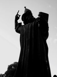 Low angle view of statue against sky