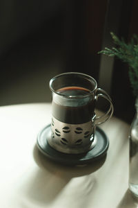 Close-up of coffee cup on table