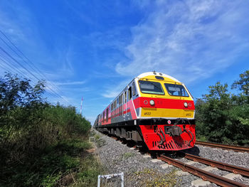 Train on railroad track against sky