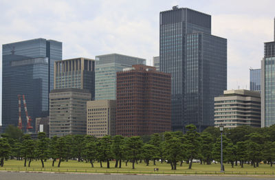 Skyscrapers in city against sky