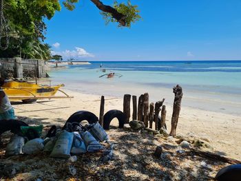 People on beach against sky