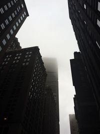 Low angle view of modern buildings against sky