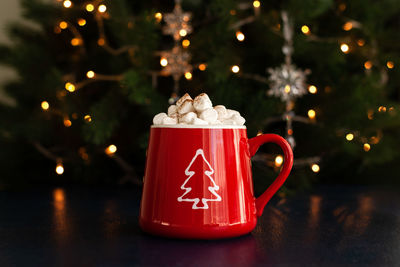 Illuminated christmas decoration on table