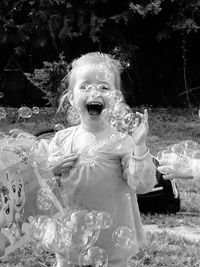 Close-up of happy girl on field