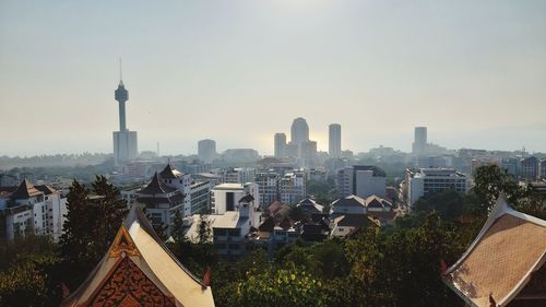 Buildings in city against sky