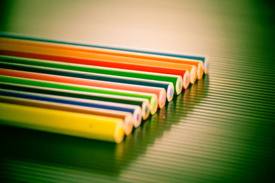High angle view of multi colored pencils or crayons on table