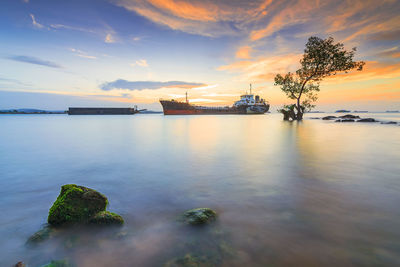 Scenic view of sea against sky during sunset