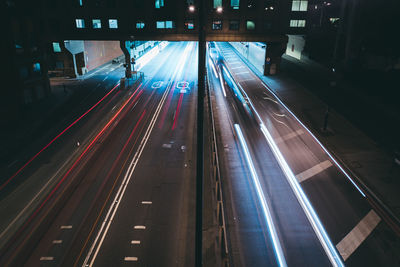 High angle view of light trails on road in city