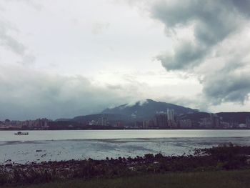 Scenic view of sea against cloudy sky