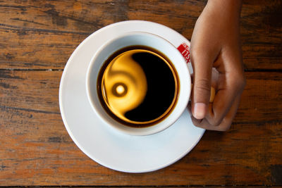 High angle view of coffee cup on table