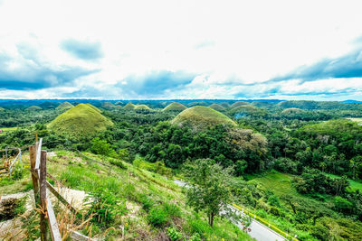 Scenic view of landscape against cloudy sky