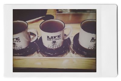 Close-up of coffee cup on table