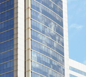 Low angle view of office building against sky