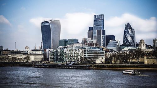 Buildings in city against sky