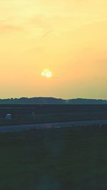 Scenic view of landscape at sunset