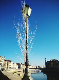 Low angle view of built structure against clear blue sky