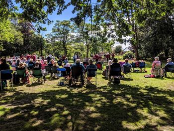 Group of people relaxing in park