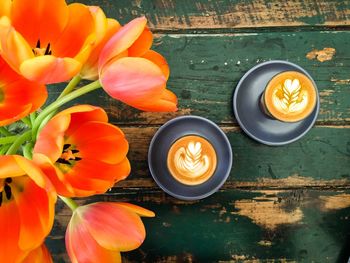 High angle view of orange tulips on table