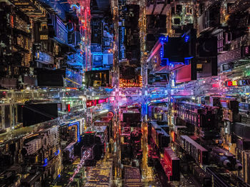 High angle view of illuminated buildings in city at night