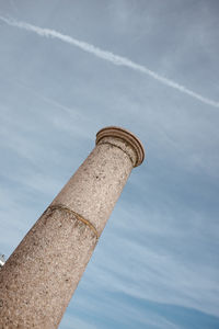 Low angle view of smoke stack against sky