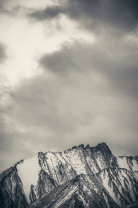 Scenic view of snowcapped mountains against sky.