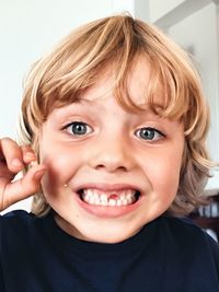 Close-up portrait of boy with gap toothed
