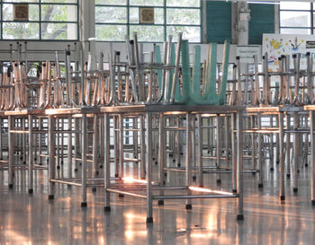 Reflection of empty glass on table in restaurant