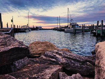 Boats moored at harbor