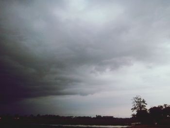 Scenic view of landscape against cloudy sky