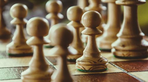 Close-up of chess pieces on board