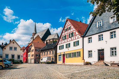 Buildings in city against sky