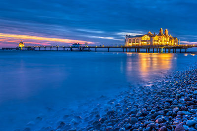 View of bridge over sea at sunset