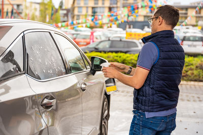 Man holding car