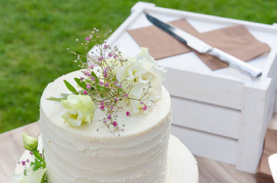 Close-up of white cake served on table