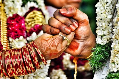 Close-up of couple holding hands