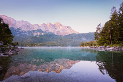 Beautiful panorama shot of the sunrise at this lake in the bavarian alps.